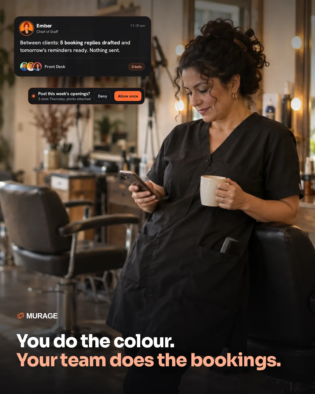 You do the colour. Your team does the bookings. A salon owner leaning on a styling chair with coffee between clients, reading her phone, while Ember reports booking replies drafted and asks before posting the week's openings.
